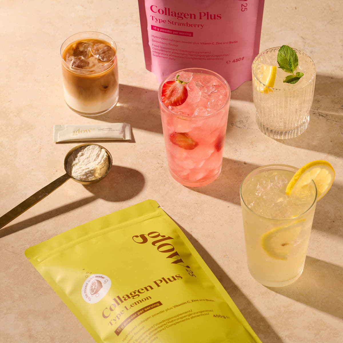 Iced coffee, strawberry and lemon drinks with a scoop of collagen powder and Glow25 Collagen Plus pouches